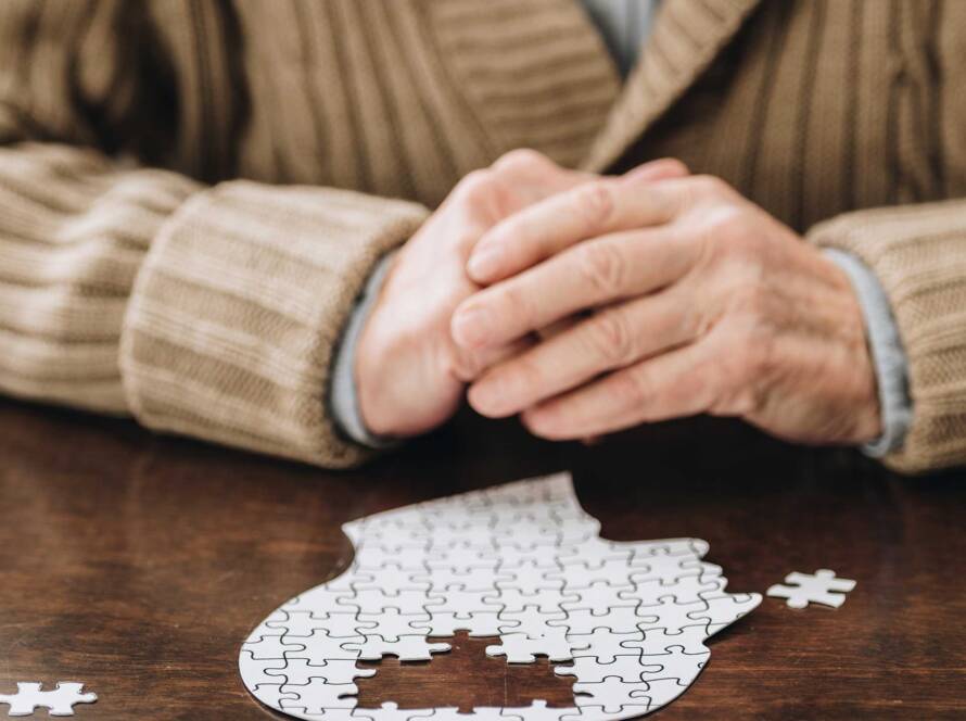 Person solving a brain puzzle to assess cognitive function